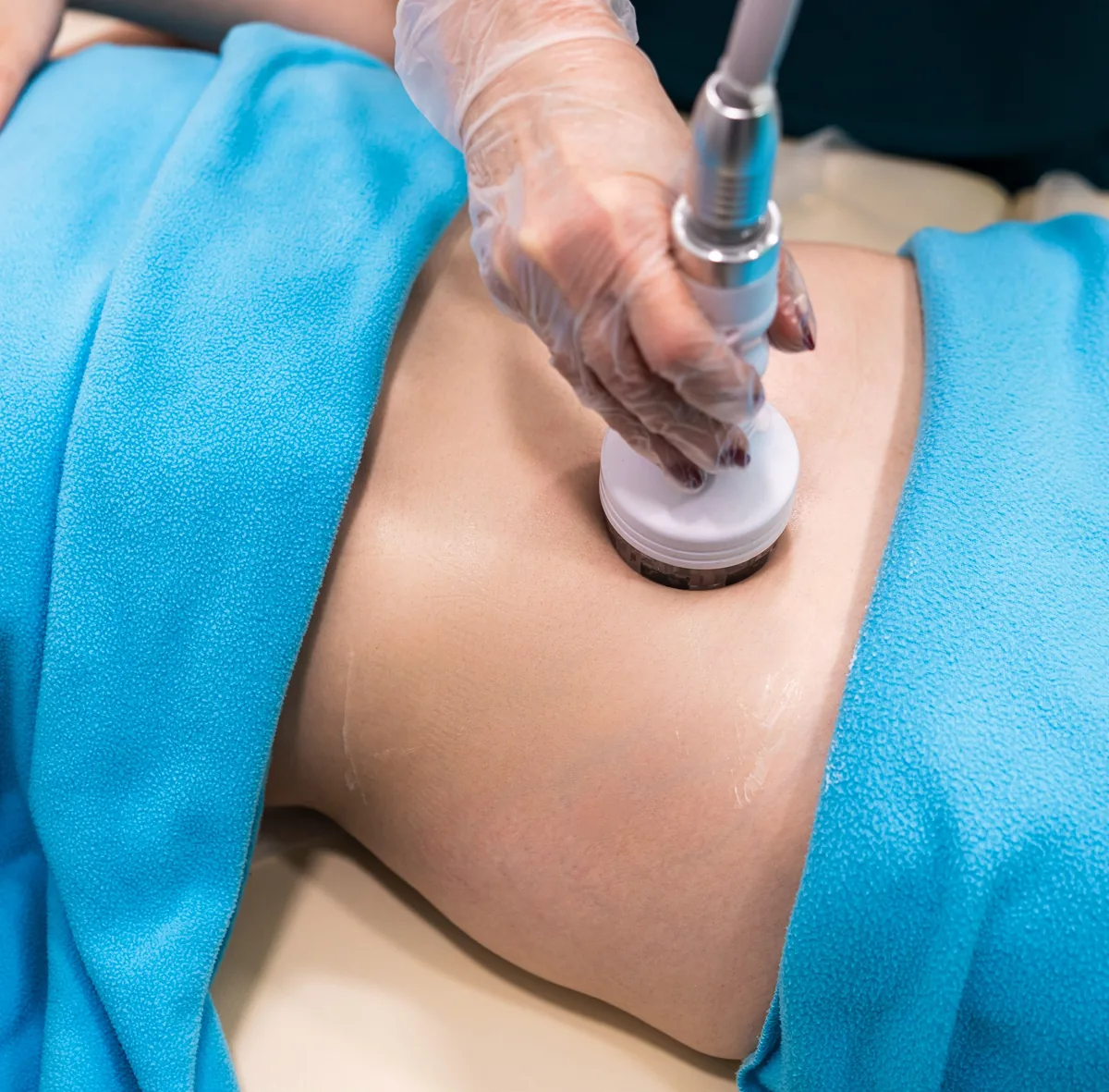 Therapist performing a body treatment on the stomach