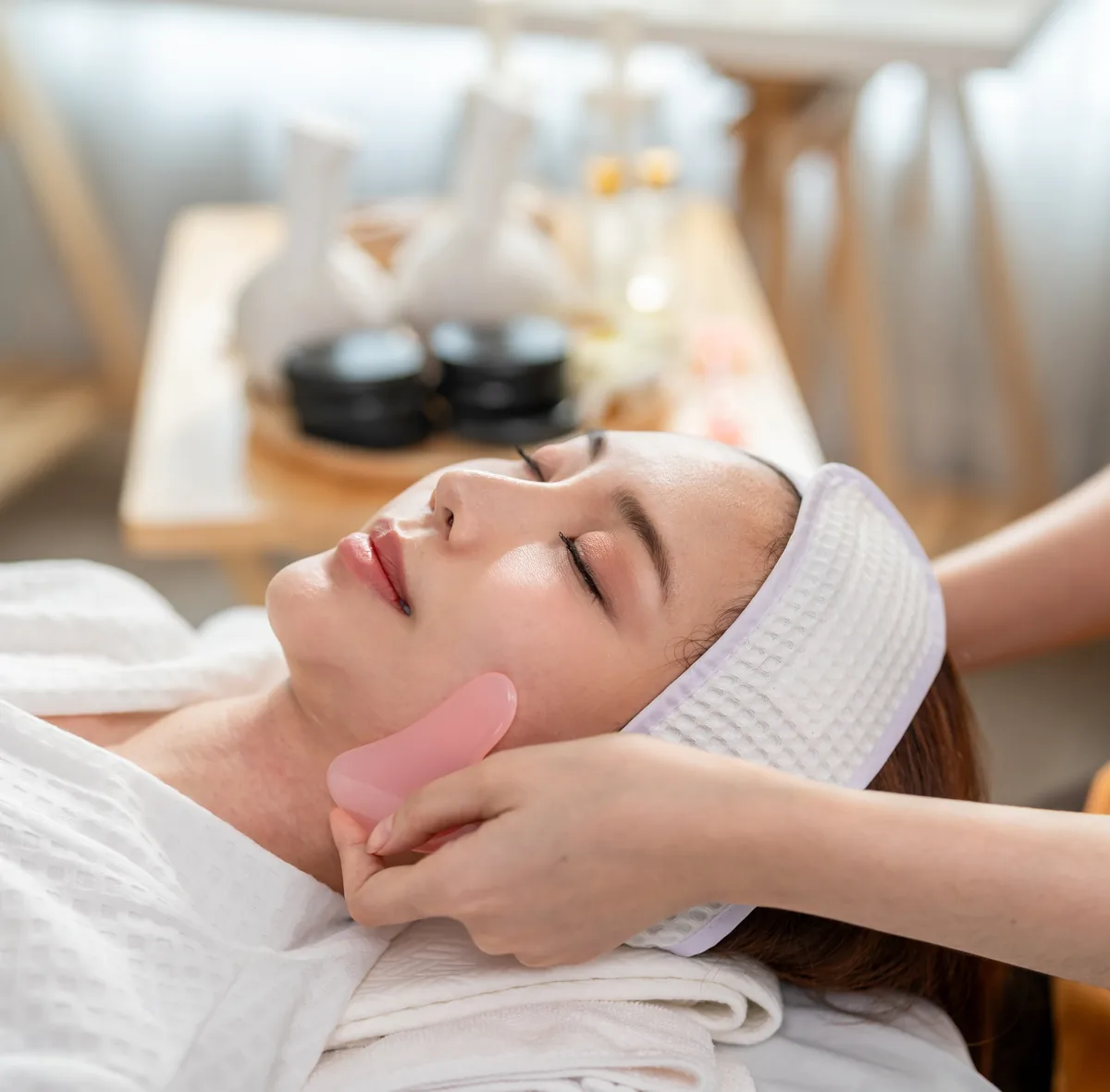 Therapist giving a client a relaxing facial