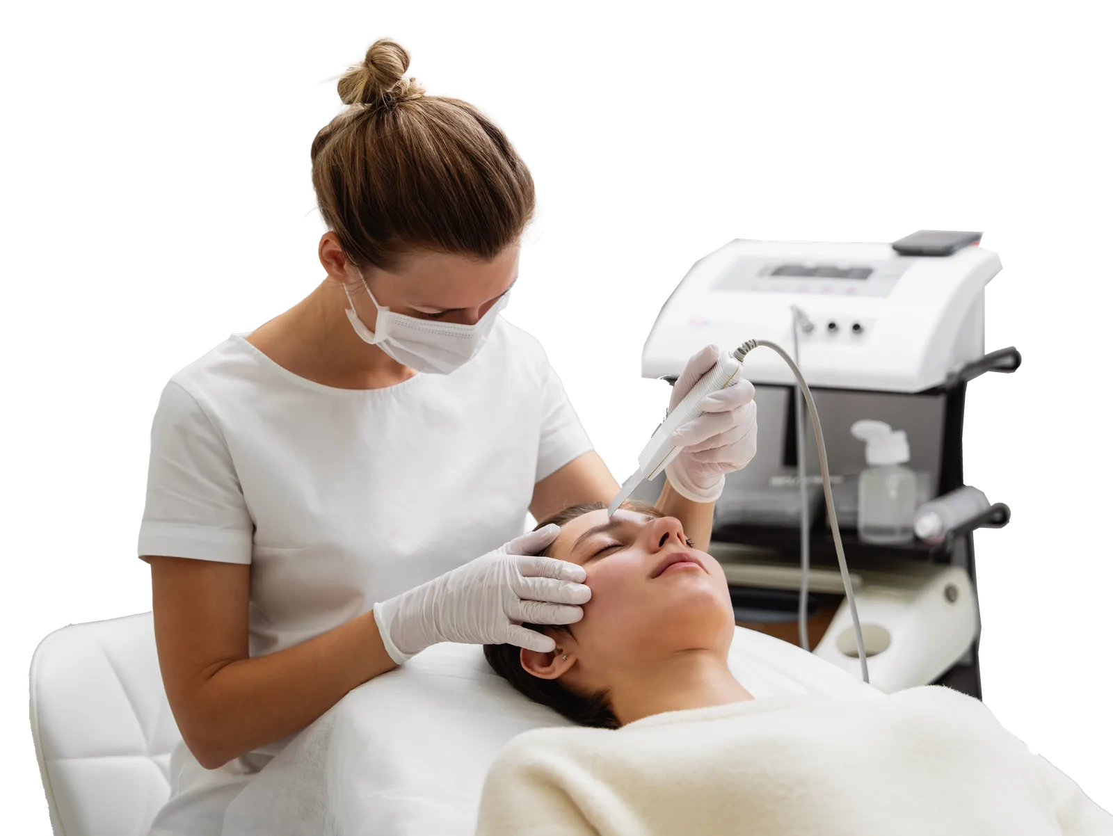 Therapist performing a facial treatment with a skin device